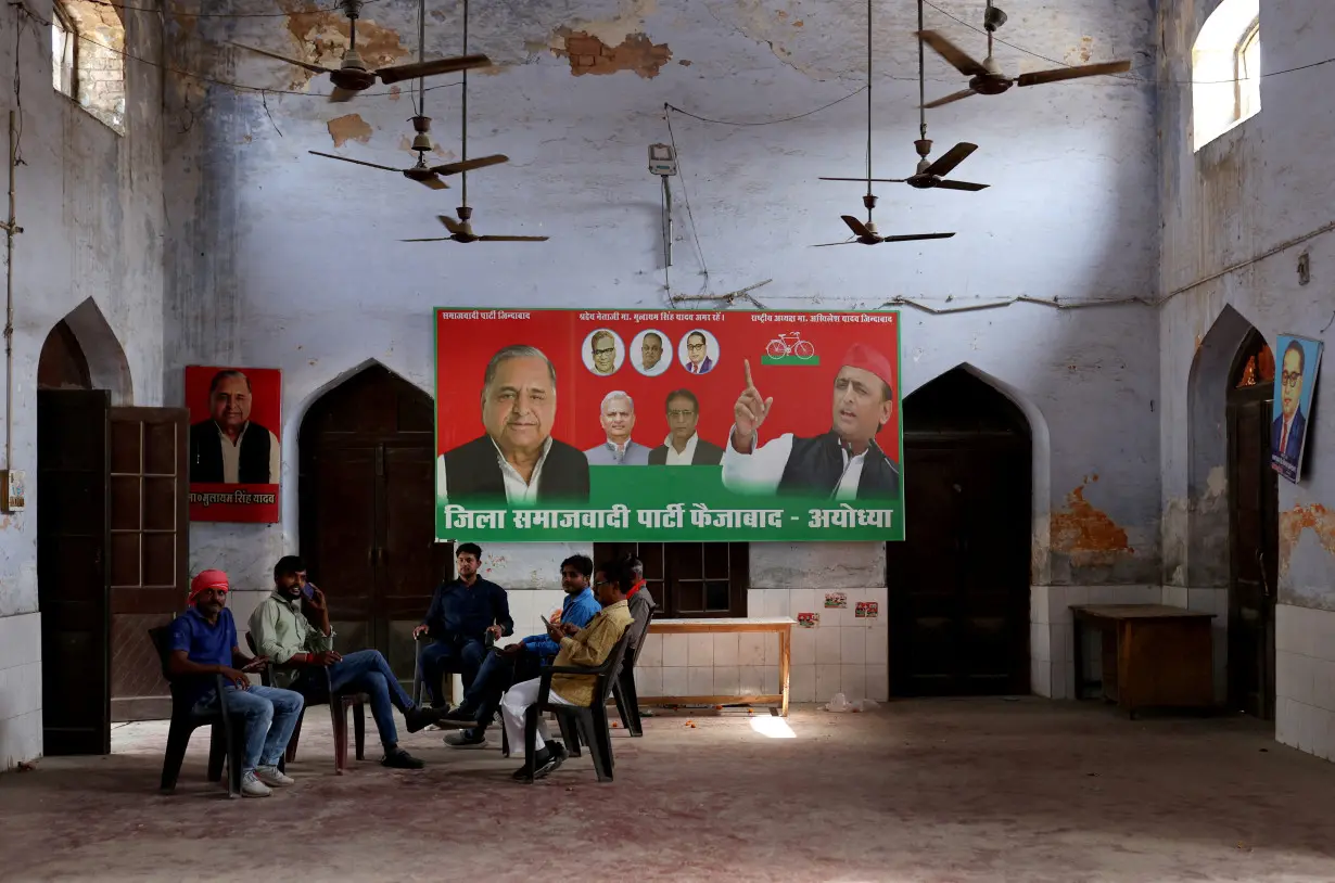 FILE PHOTO: Members of Samajwadi Party sit inside their party office, a day after India's general election results, in Ayodhya