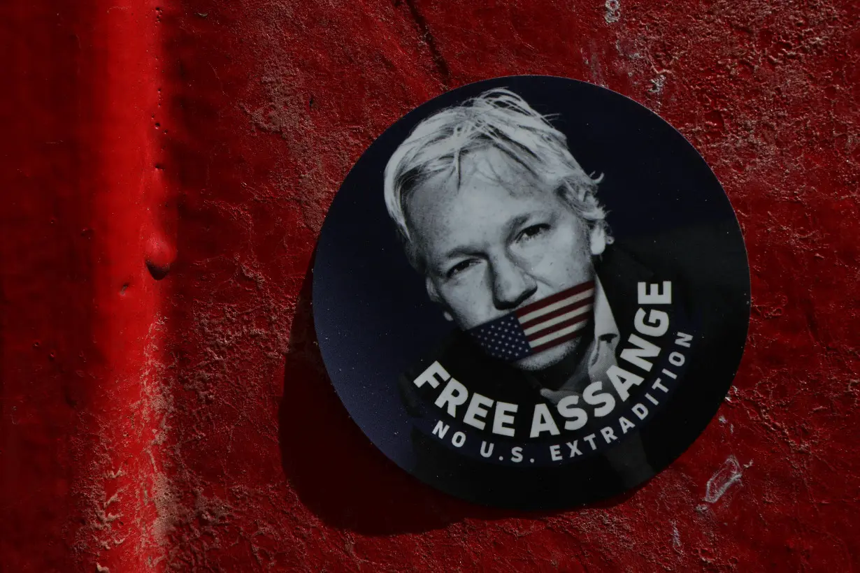 A sticker depicting Julian Assange in London