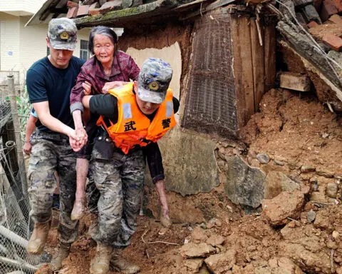 Rains lash southern China as rising rivers threaten more flooding