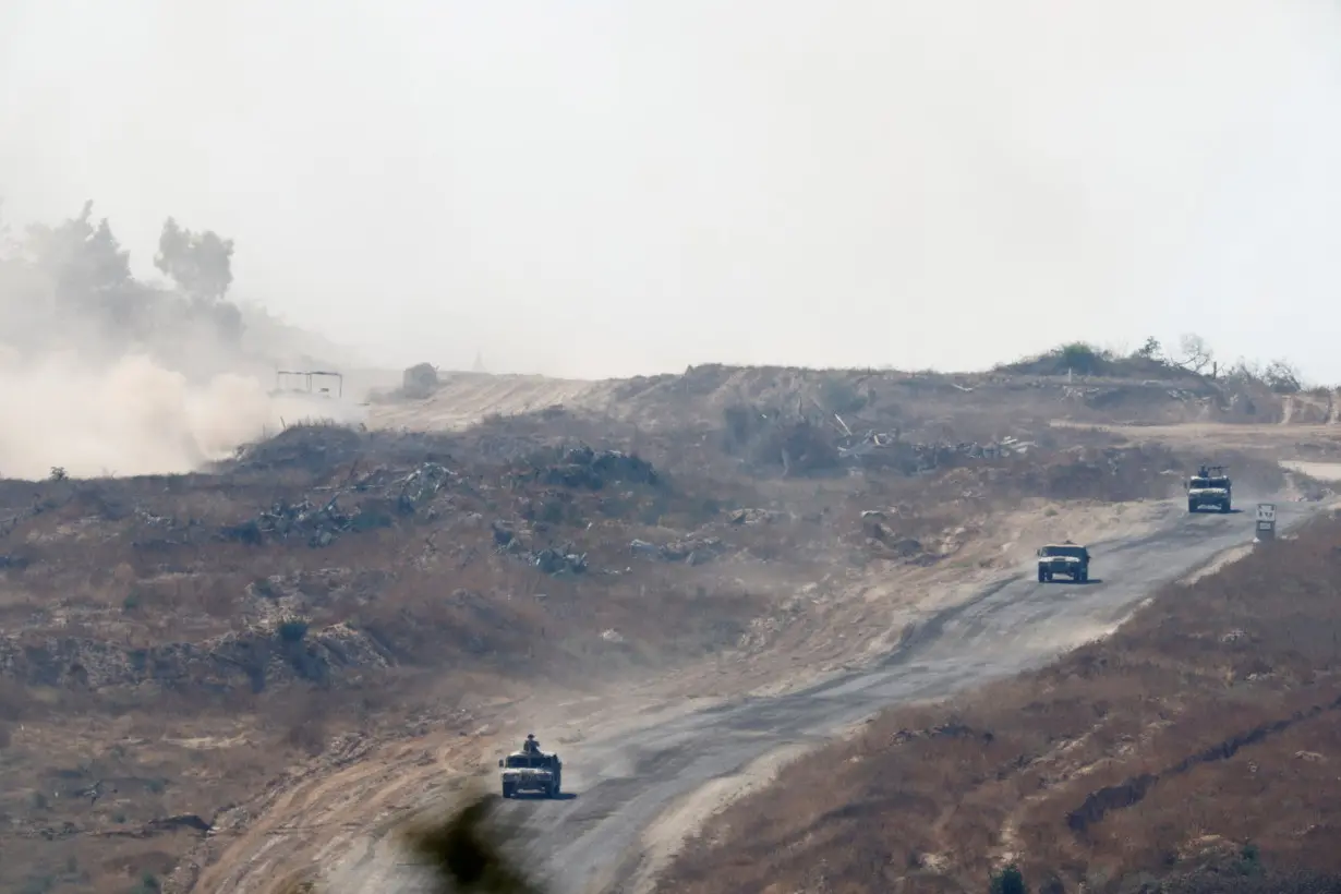 Israeli military vehicles manoeuvre inside the Gaza Strip, near the Israel-Gaza border