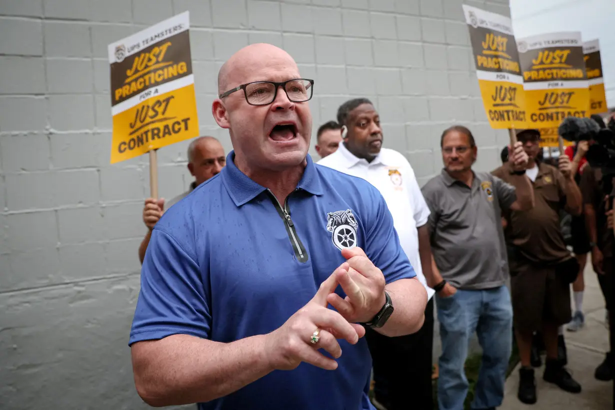 FILE PHOTO: UPS Teamsters picket ahead of an upcoming possible strike in Brooklyn, New York