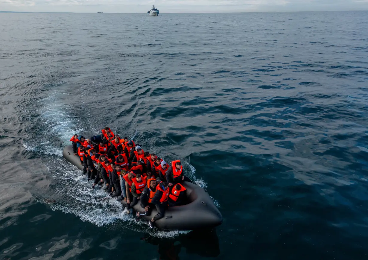 Migrants cross the English Channel in small boats