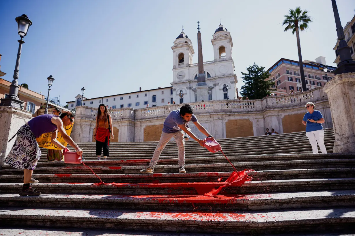 Activists pour red paint on the Spanish Steps to protest against femicides in Rome