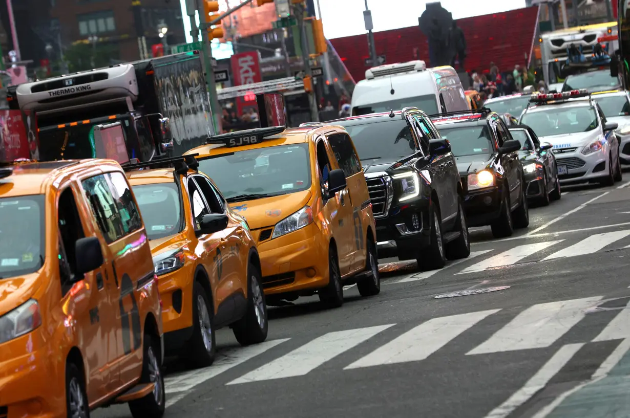 FILE PHOTO: Vehicles sit in a line of traffic in Times Square in Manhattan in New York City