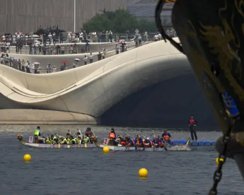 Taiwan nighttime dragon boat racing puts a modern twist on an ancient tradition