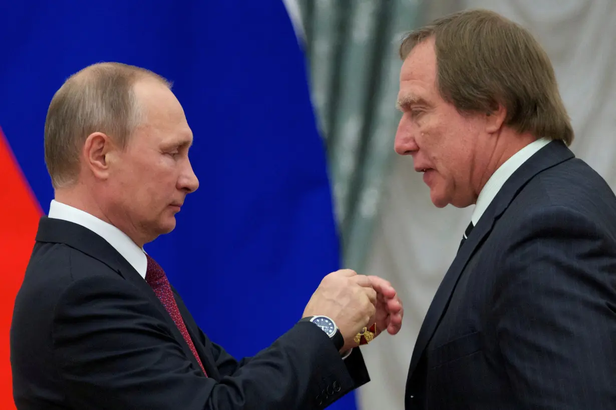 FILE PHOTO: Russian President Putin awards Sergey Roldugin during a ceremony at the Kremlin in Moscow