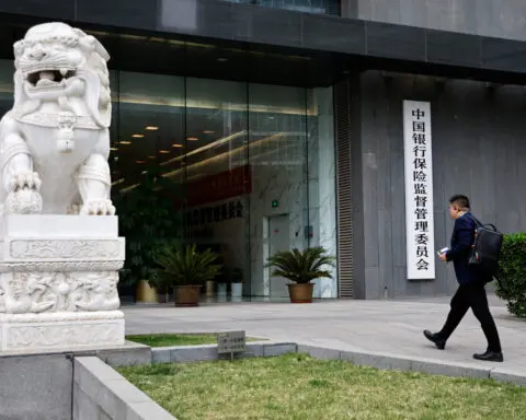 China orders small banks to curtail wealth management business, sources say