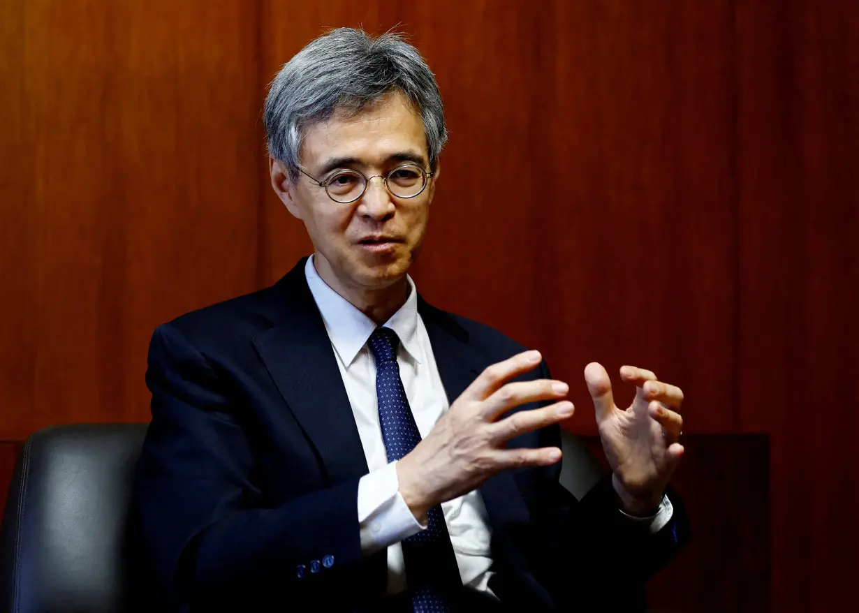 FILE PHOTO: Bank of Japan Deputy Governor Ryozo Himino