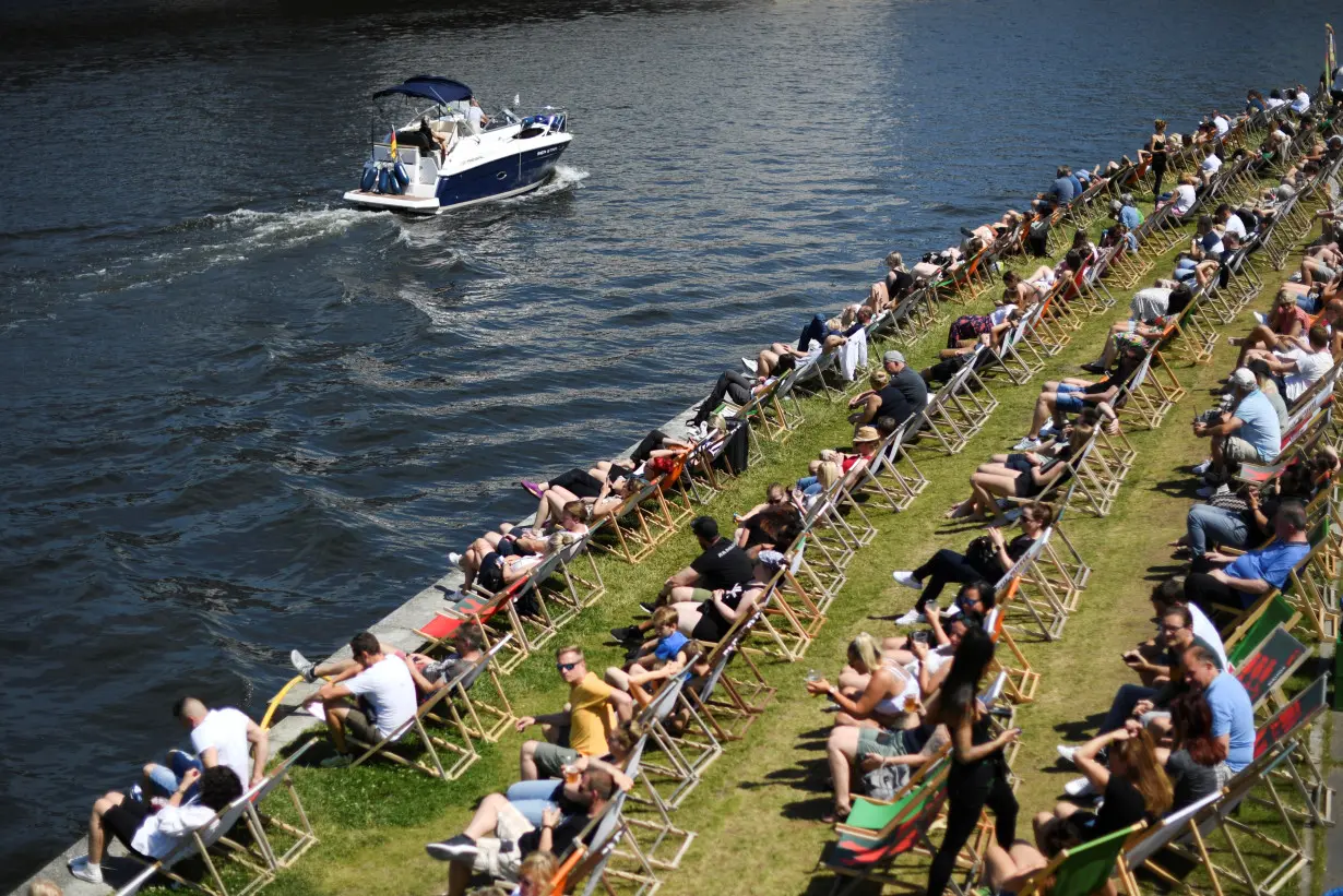 People enjoy the sunny weather on feast days of Pentecost in Berlin