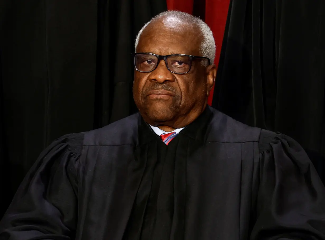 U.S. Supreme Court justices pose for their group portrait at the Supreme Court in Washington