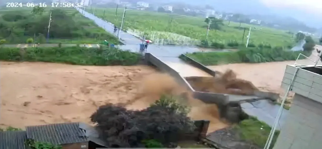 A bridge collapses following heavy rainfall and flooding in Dongshi Town, Meizhou City, Guangdong Province