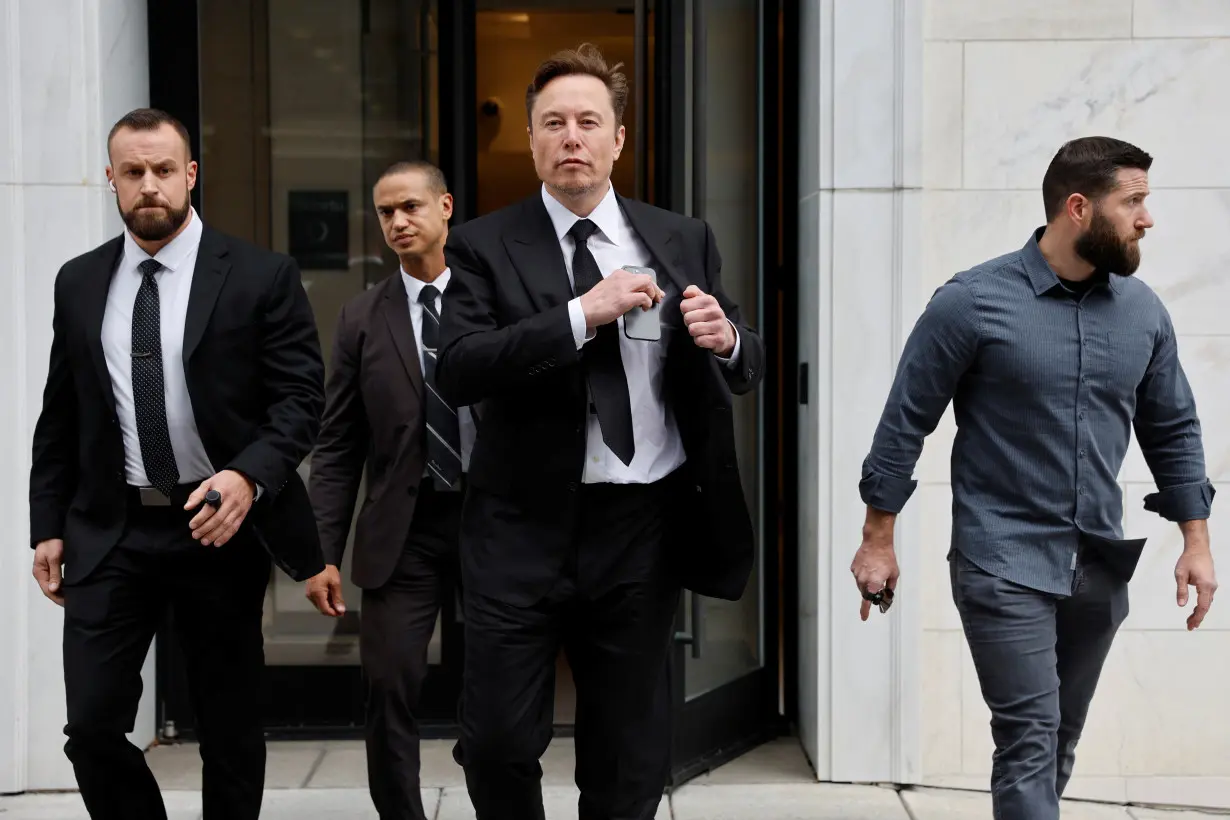 Tesla CEO Musk departs the company’s local office in Washington