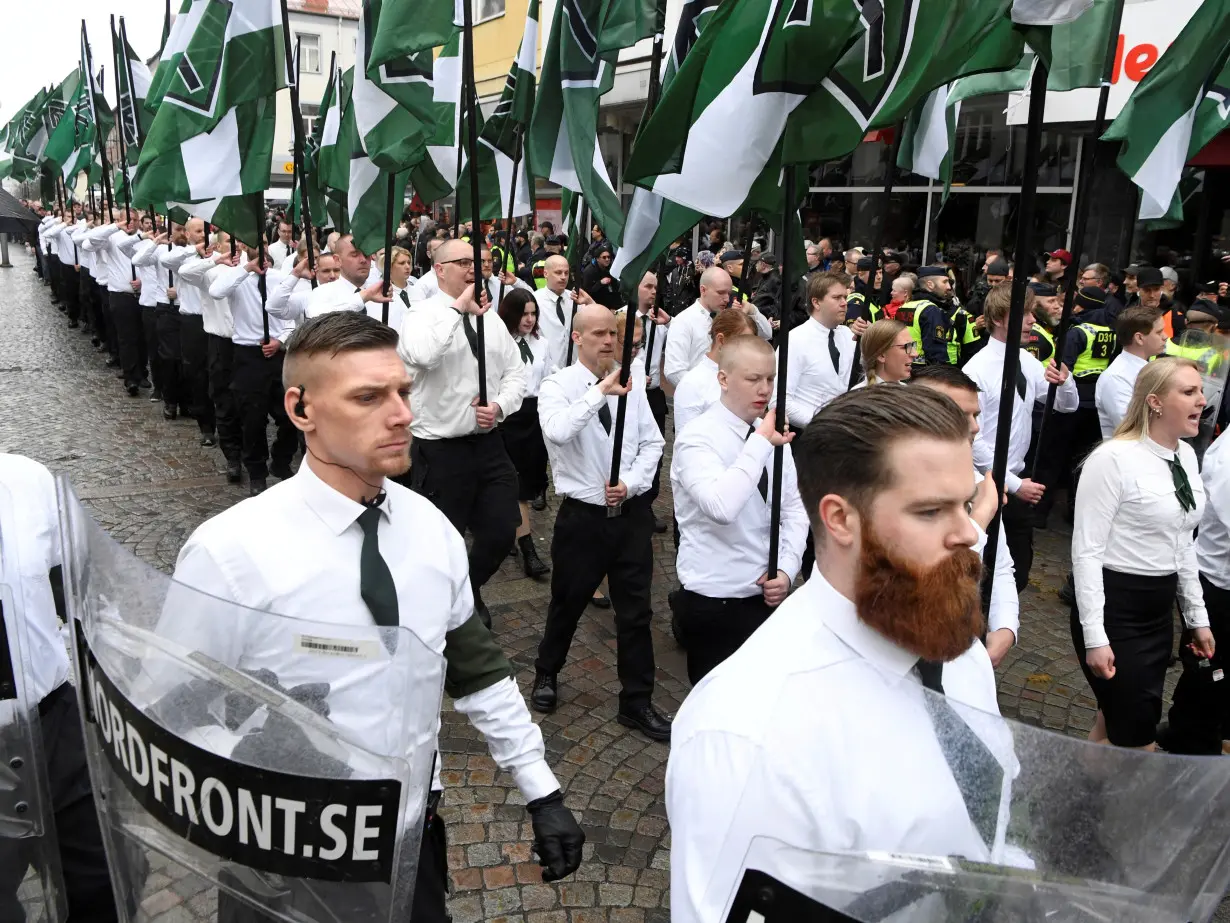 FILE PHOTO: Members of the Neo-nazi Nordic Resistance Movement march through the town of Ludvika