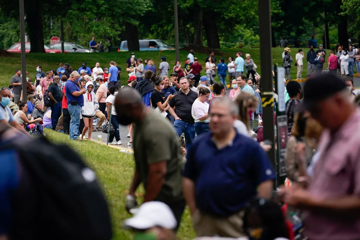 Hundreds of people line up outside a Kentucky Career Center hoping to find assistance with their unemployment claim in Frankfort