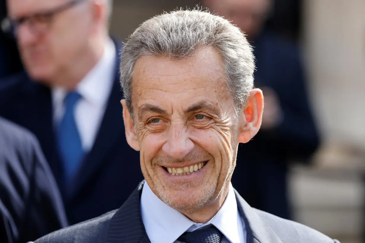 Former French President Nicolas Sarkozy attends a 