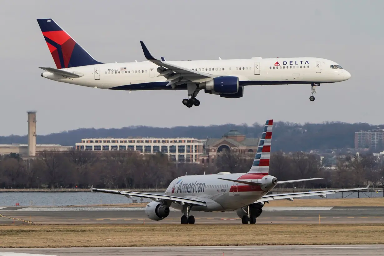 A Delta Air Lines aircraft lands at Reagan National Airport in Arlington, Virginia