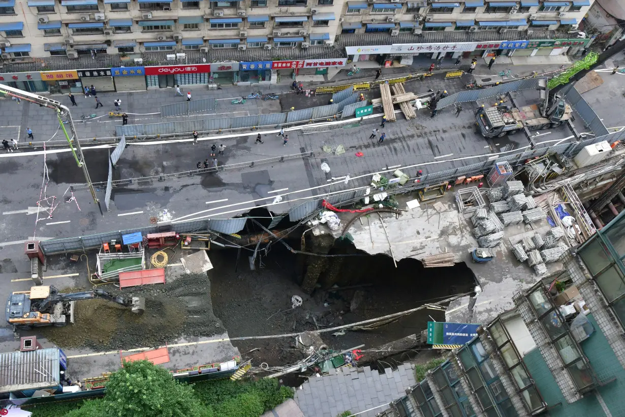 Sinkhole at a road section where a subway construction site collapsed, in Chengdu