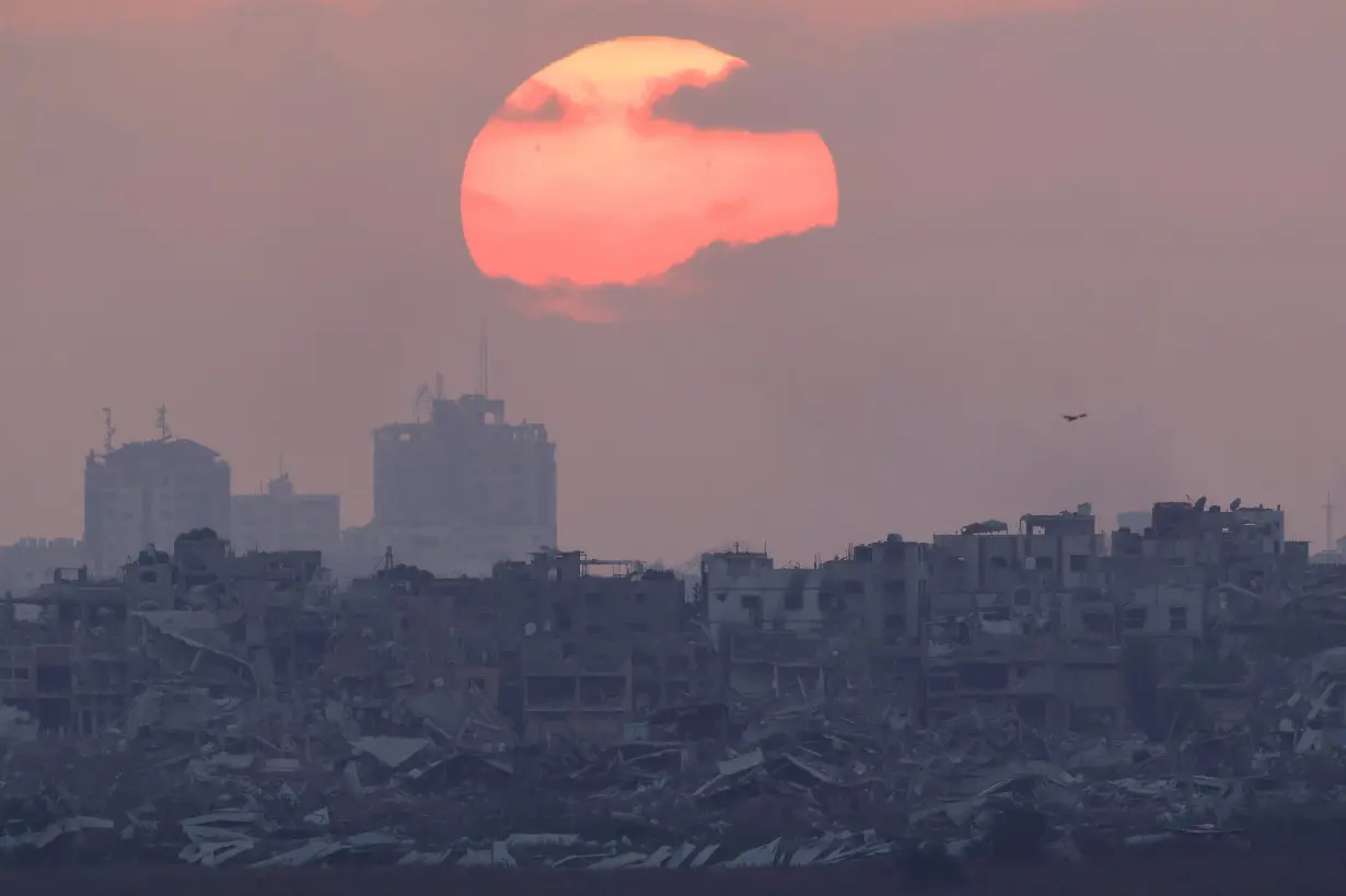 The sun sets over Gaza, amid the Israel-Hamas conflict, as seen from Israel