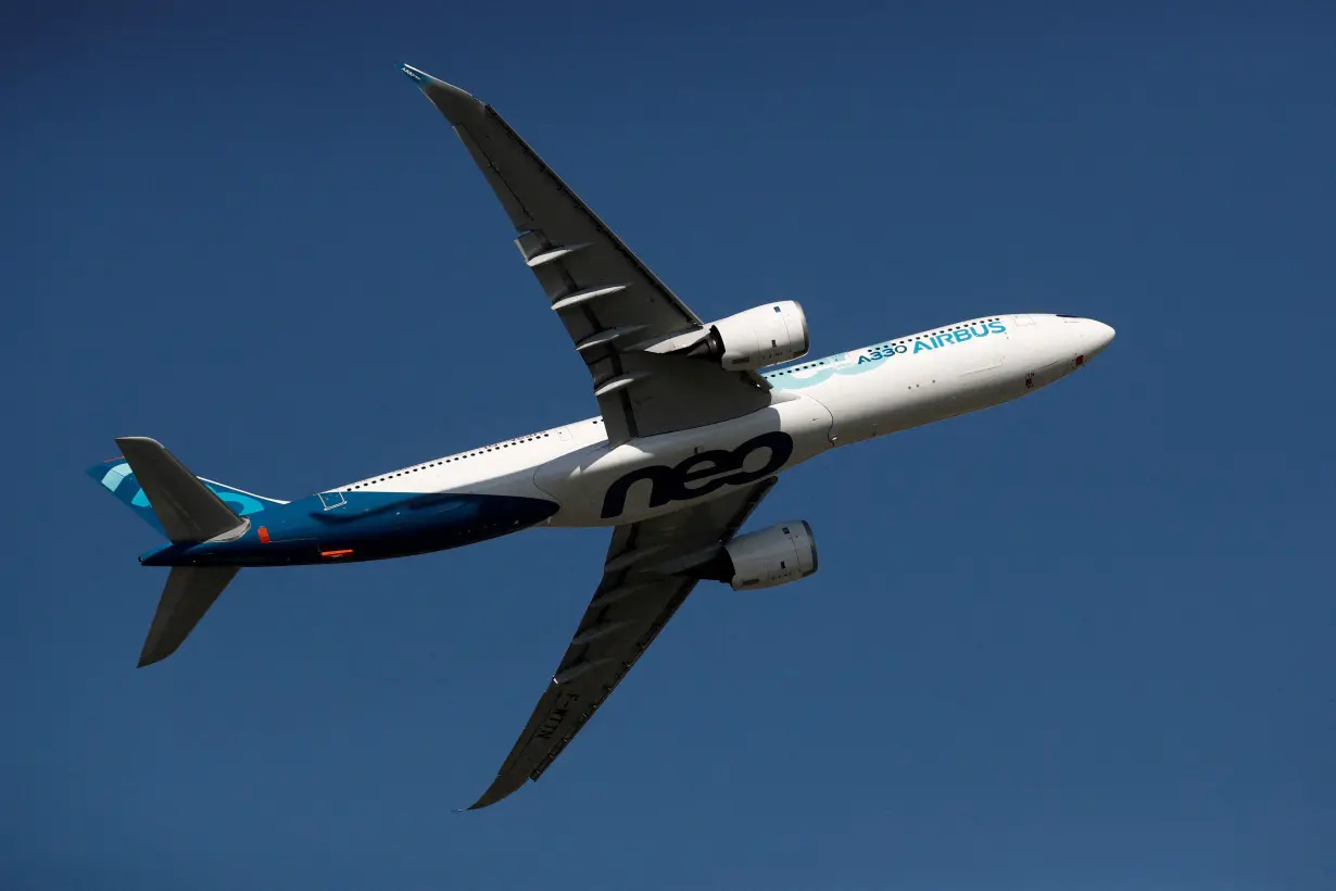 FILE PHOTO: An Airbus A330neo aircraft performs during the inauguration of the 53rd International Paris Air Show at Le Bourget Airport near Paris