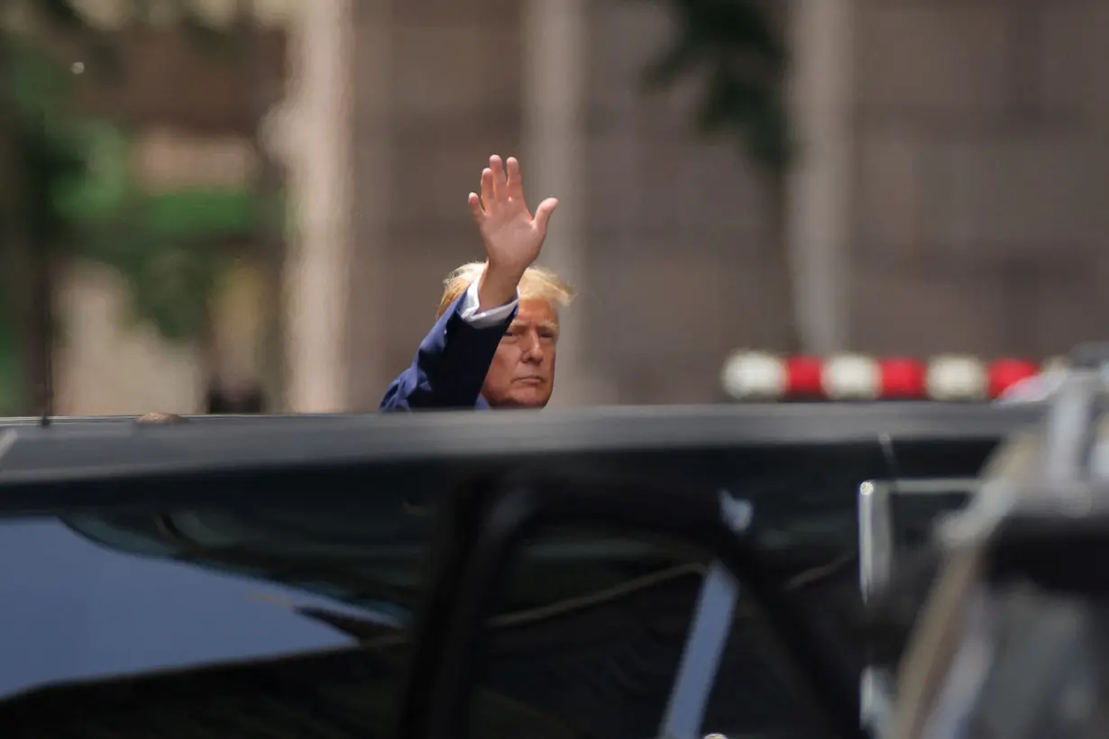 FILE PHOTO: Former U.S. President walks outside Trump Tower, in New York