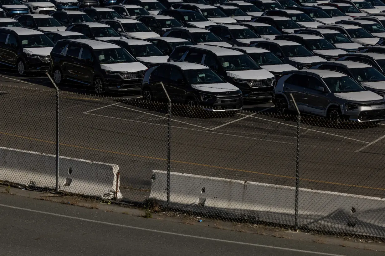 New vehicles are seen at a parking lot in the Port of Richmond, California