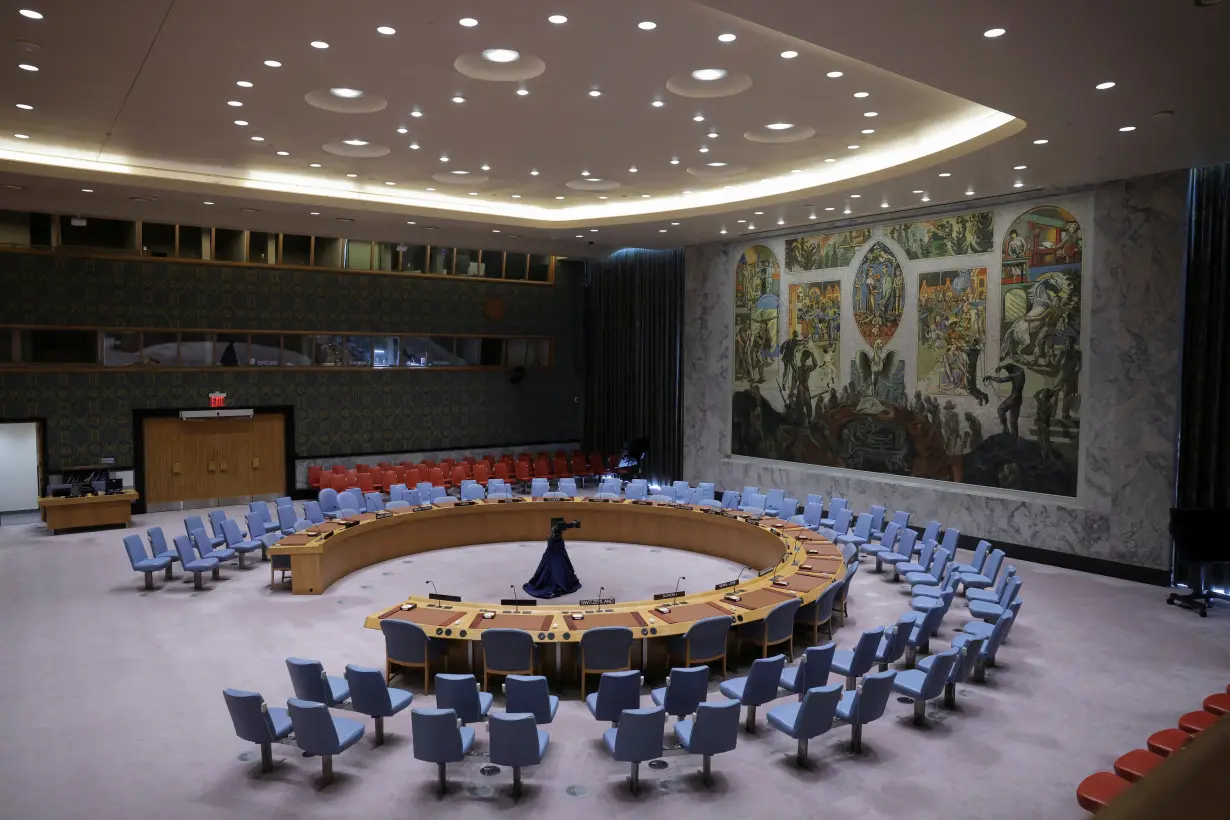 Members of the United Nations Security Council vote on a Gaza resolution that demands an immediate ceasefire, in New York