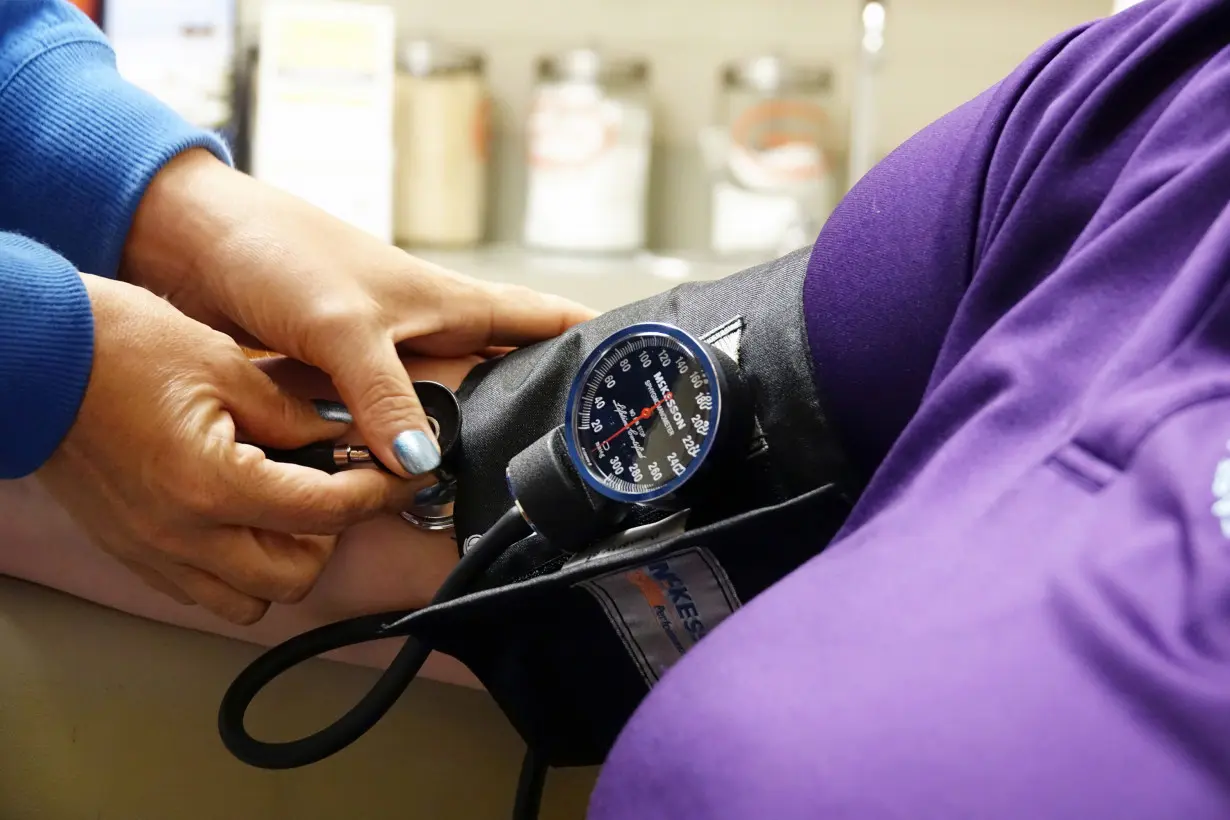 A nurse takes someones blood pressure inside of the East Arkansas Family Health Center in Lepanto