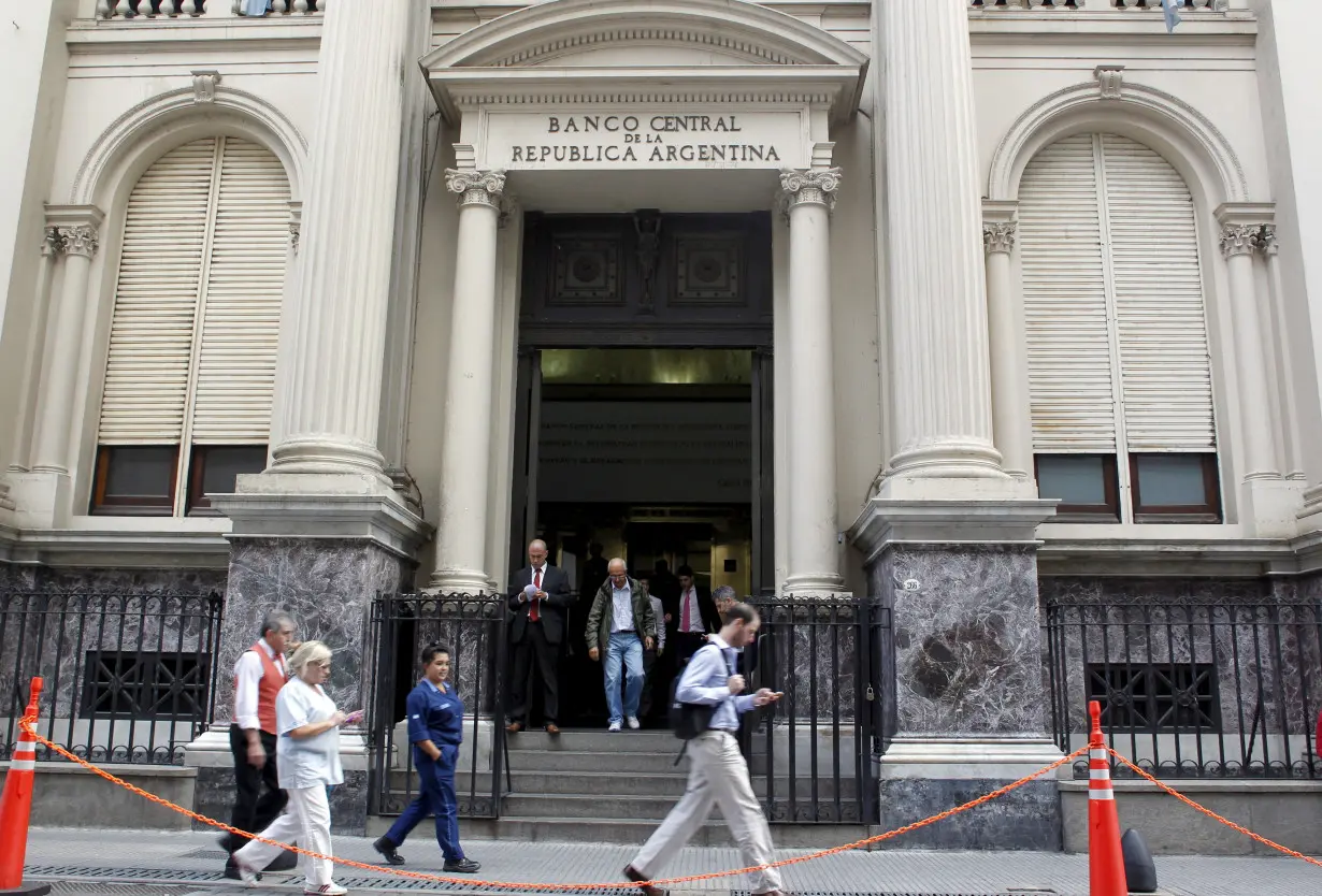 FILE PHOTO: Pedestrians past by Argentina's Banco Central Bank in Buenos Aires' financial district