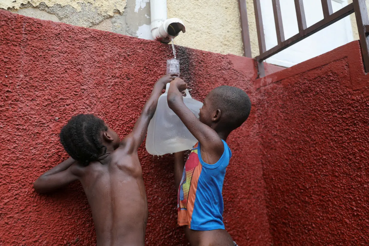 FILE PHOTO: Boys displaced by gang violence shelter at a school, in Port-au-Prince