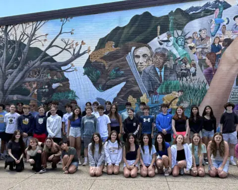 Double take: 23 sets of twins graduate from a single Massachusetts middle school