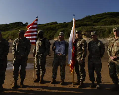 Black D-Day combat medic's long-denied medal tenderly laid on Omaha Beach where he bled, saved lives