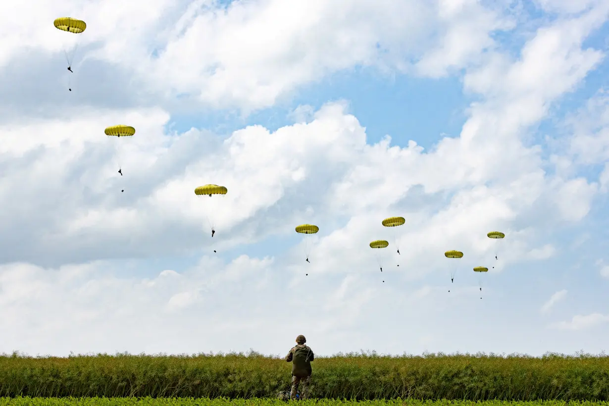 FILE PHOTO: Paratroopers jump into Normandy to pay tribute to the soldiers who parachuted in on D-Day in Sannerville, Normandy