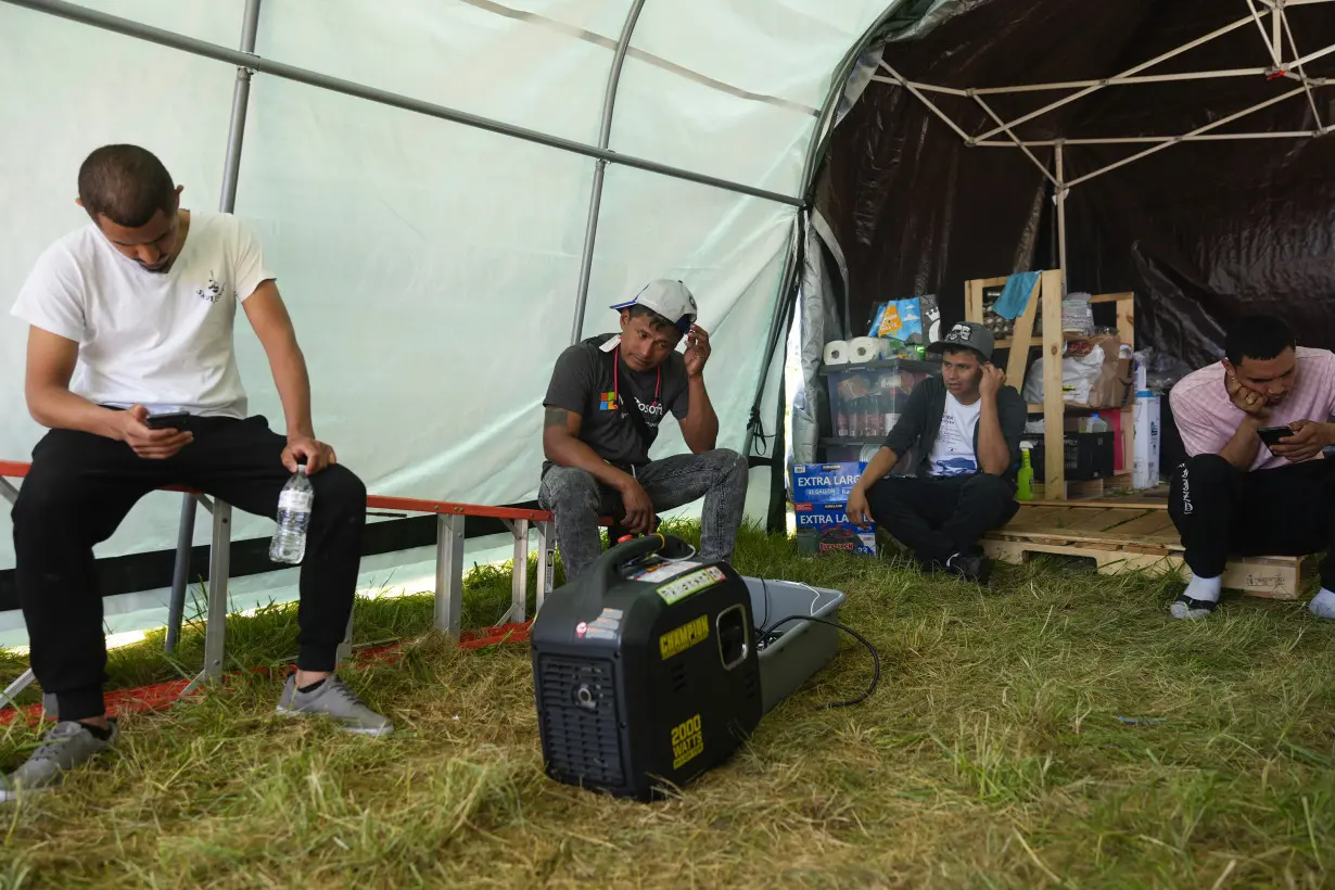 Hundreds of asylum-seekers are camped out near Seattle. There's a vacant motel next door