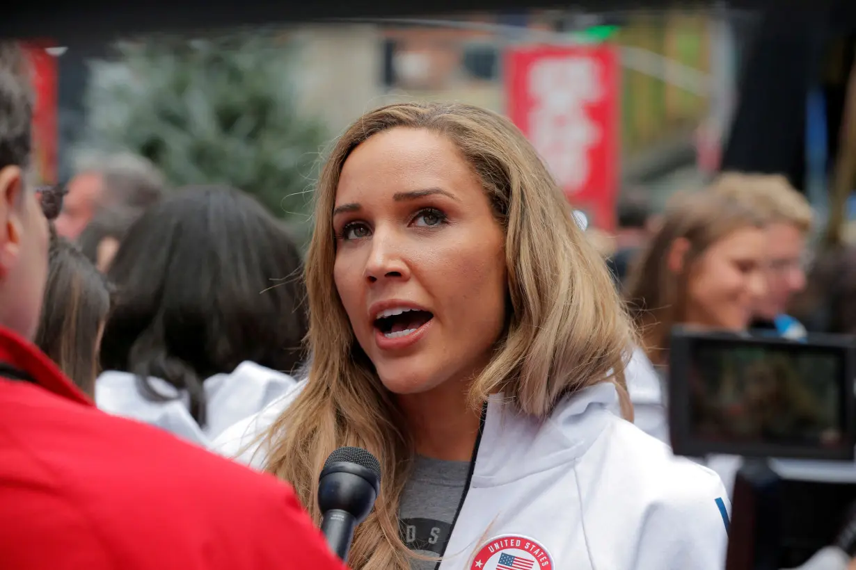 FILE PHOTO: Olympian Lolo Jones is interviewed during an event in Times Square to celebrate 100 days from the start of the PyeongChang 2018 Olympic Games in South Korea, in New York