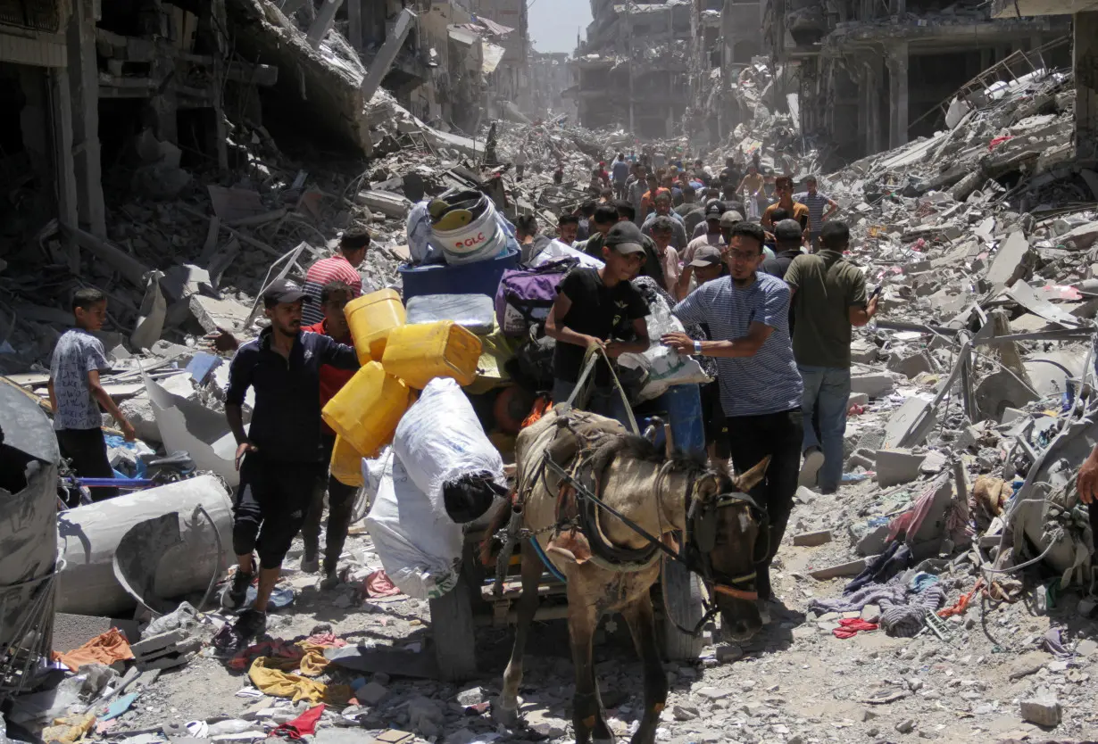 Palestinians inspect the damage after Israeli forces withdrew from Jabalia refugee camp