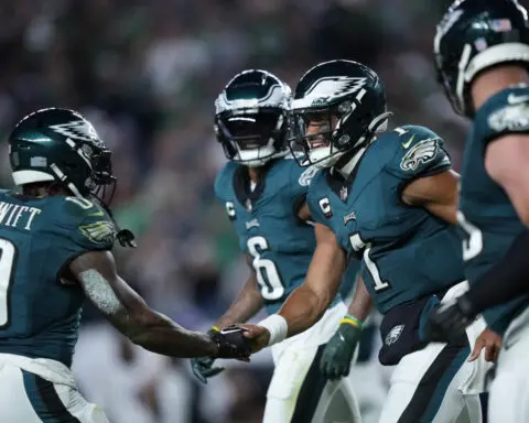 Jalen Hurts runs for 2 TDs, throws for a score; Eagles hold off fumble-prone Vikings 34-28