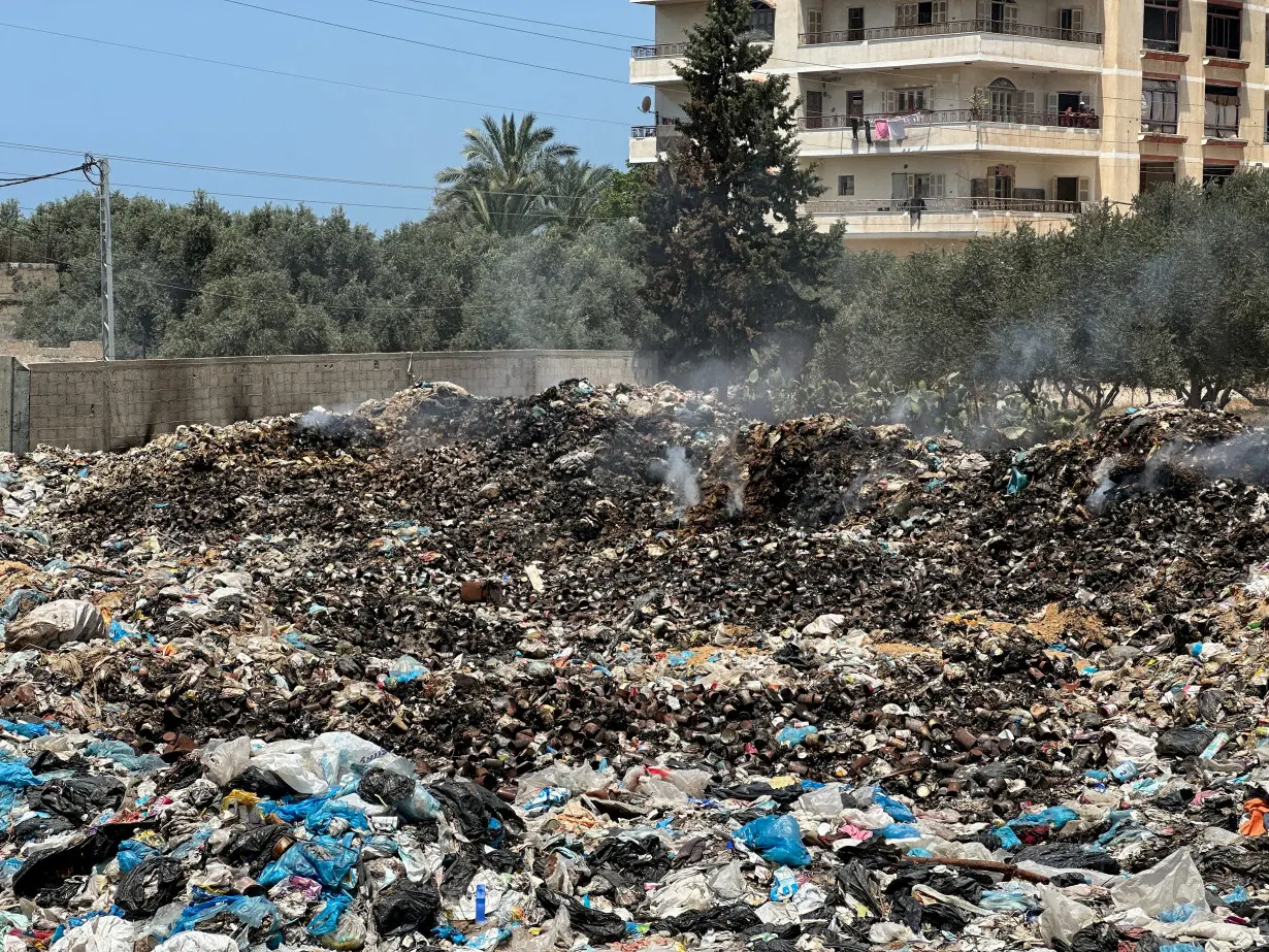 FILE PHOTO: A view shows piles of garbage, in Deir Al-Balah