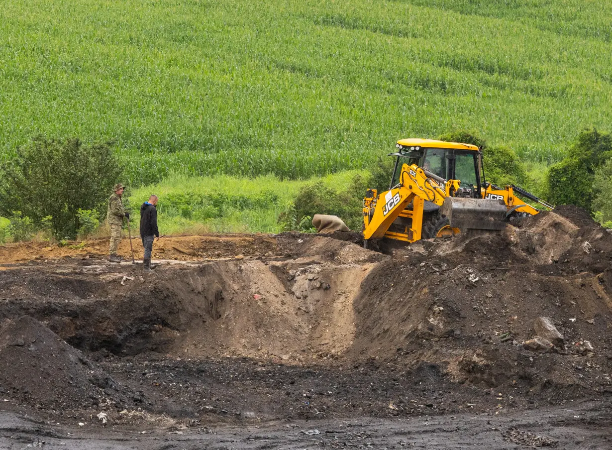 Military is seen digging at Petrovacka dola garbage yard where a new mass grave was found from the Croatian War of Independence in Vukovar