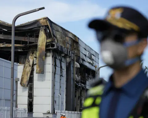 South Korean rescuers search burned factory after a blaze killed 22, mostly Chinese migrants