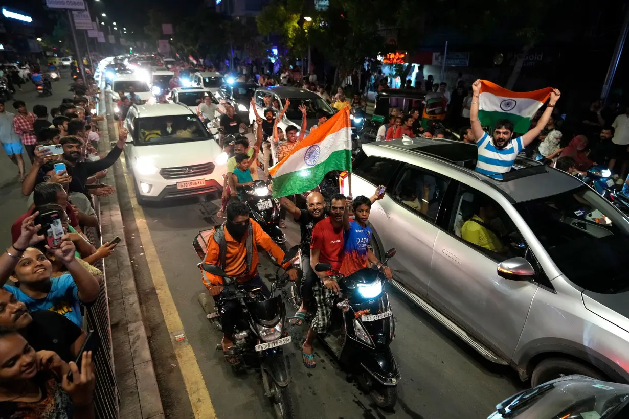 Cricket fans celebrate on the streets after India won the men's T20 World Cup final.