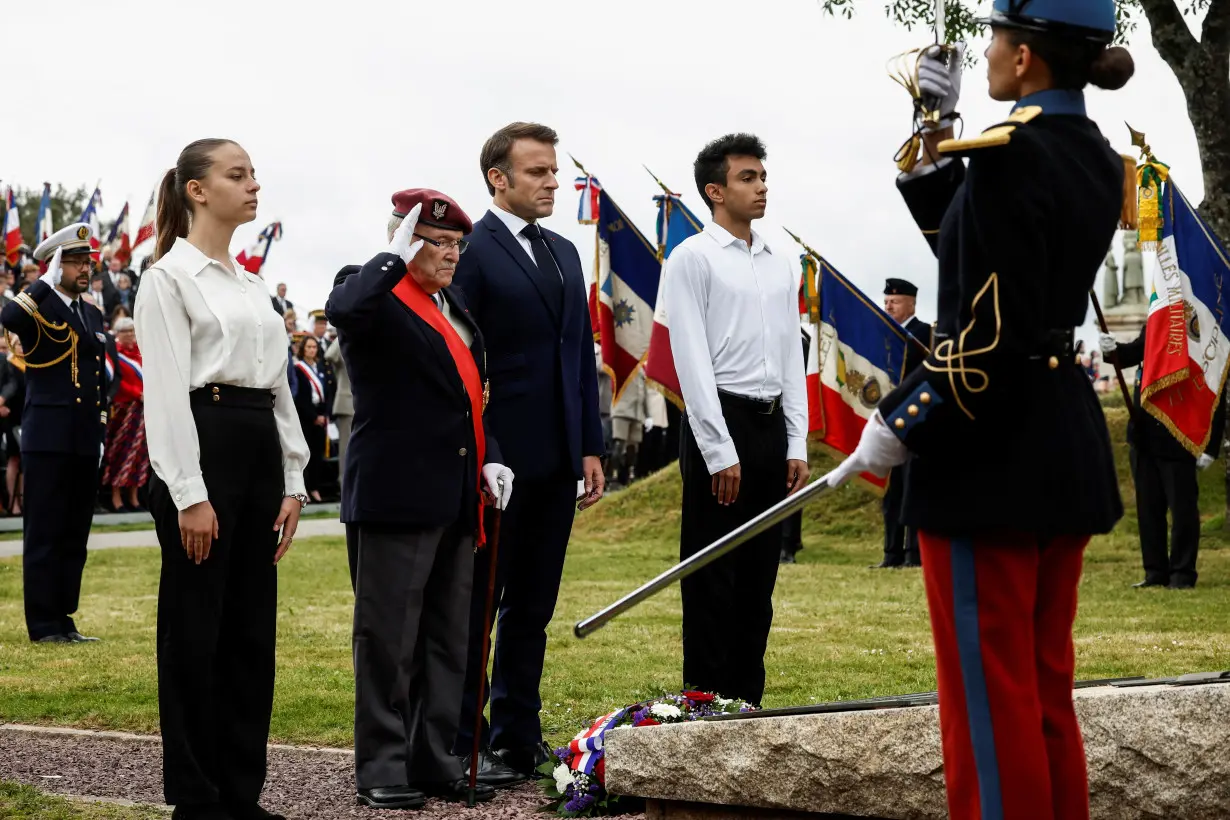 Macron pays tribute to civilian victims of D-Day bombings in Normandy