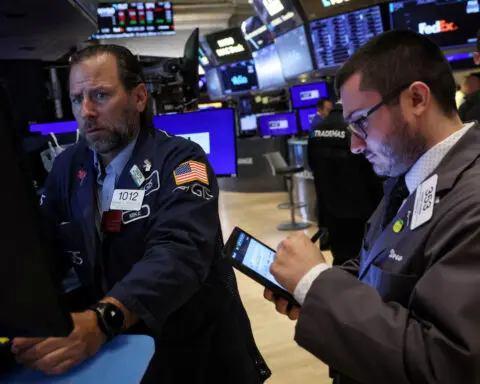 Wall Street ends lower as investors digest inflation data, presidential debate