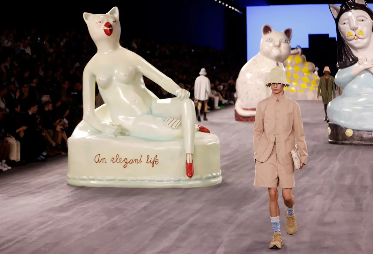 Giant cats stalk the catwalk at the Dior men's show