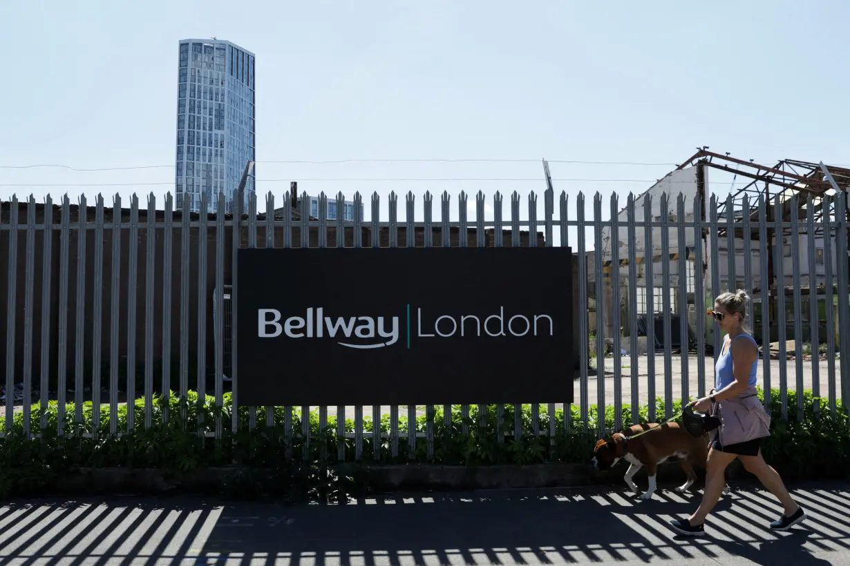 FILE PHOTO: A Bellway sign is seen at a housing construction site in London