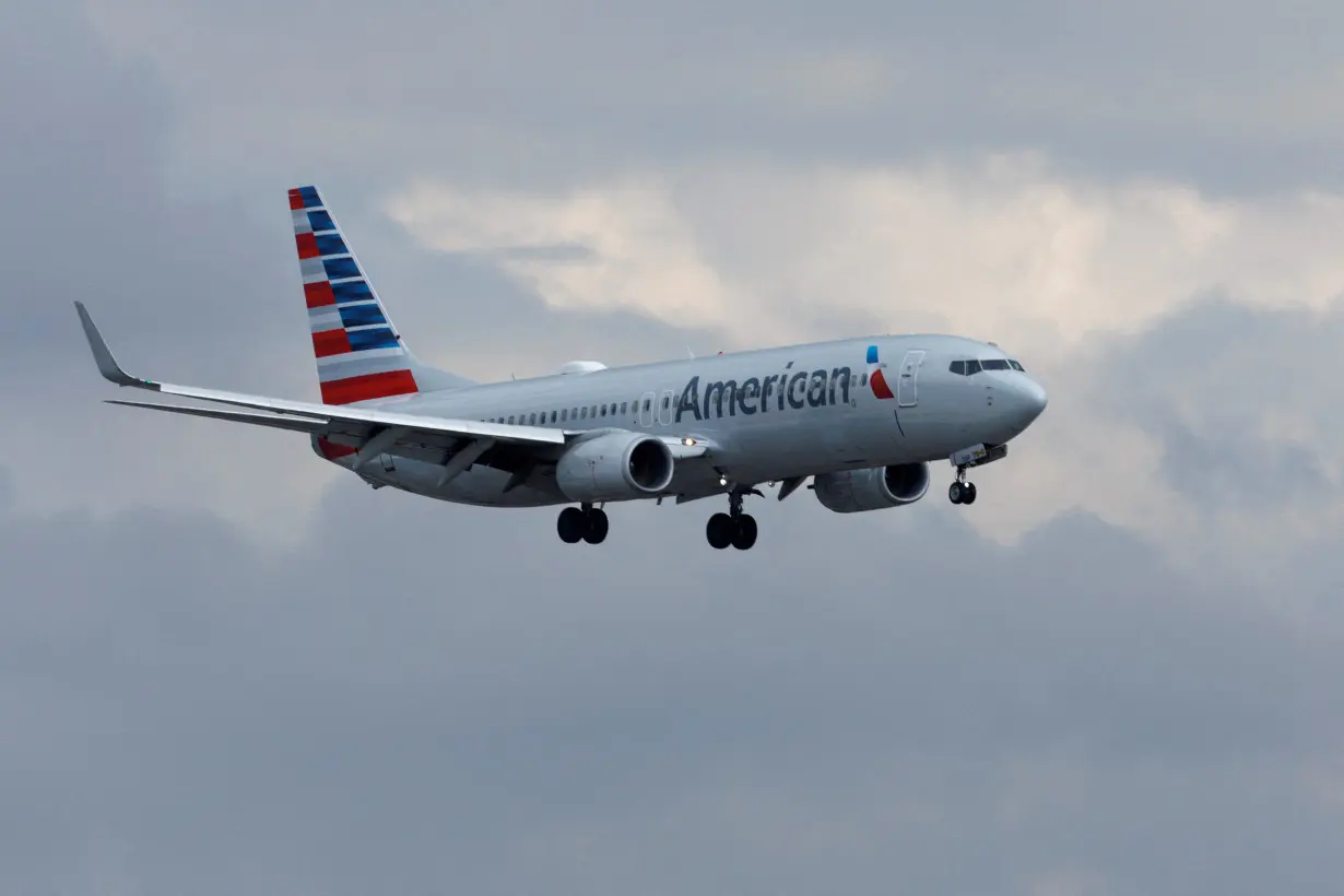 An American Airlines commercial aircraft approaches to land at John Wayne Airport in Santa Ana, California