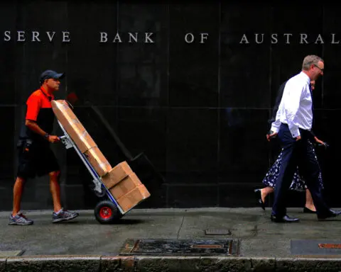 Australia's central bank says policy is restrictive, causing households pain