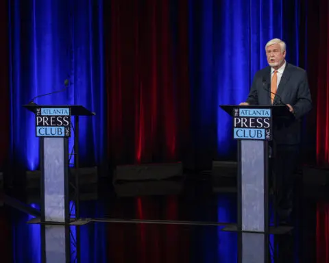 Georgia Republican convicted in Jan. 6 riot walks out during televised congressional primary debate