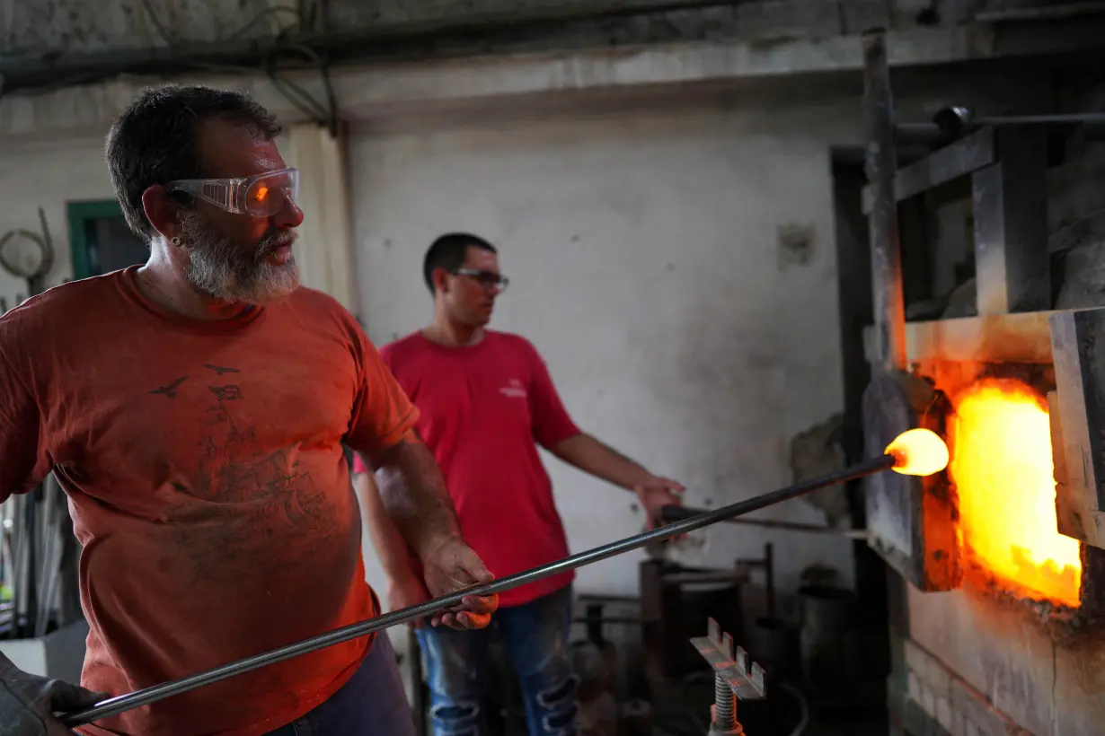 Cuba's only artisanal blown glass workshop fights to survive, in Havana