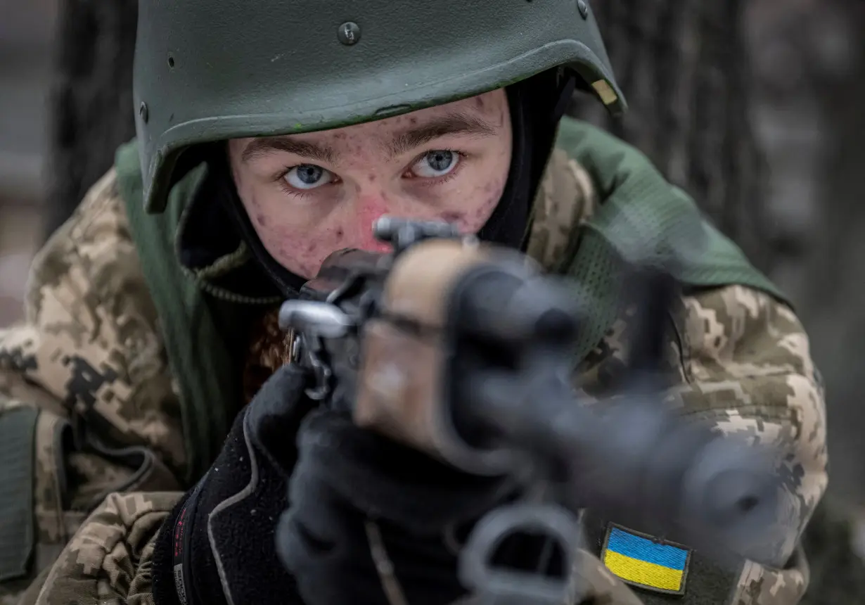 FILE PHOTO: Volunteers who aspire to join the 3rd Separate Assault Brigade of the Ukrainian Armed Forces attend basic training in the Kyiv region