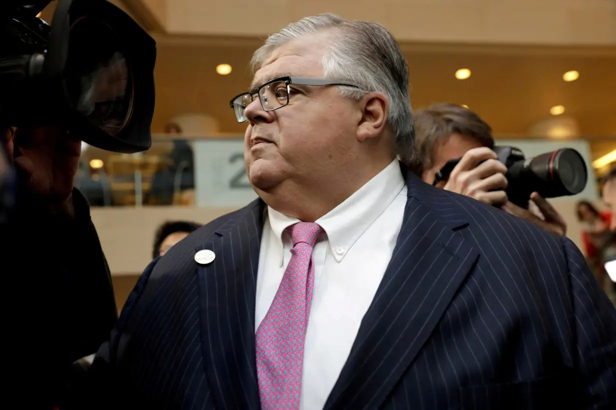 FILE PHOTO: BIS General Manager Agustin Carstens leaves after G-20 finance ministers and central banks governors family photo during the IMF/World Bank spring meeting in Washington